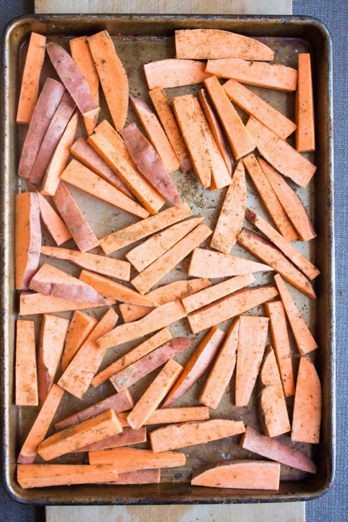 baked sweet potato fries on a baking sheet