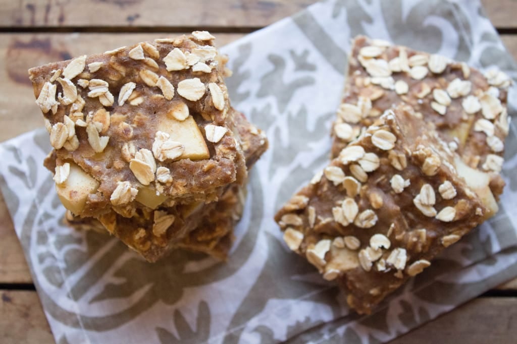 cinnamon apple oatmeal bars on a patterned napkin