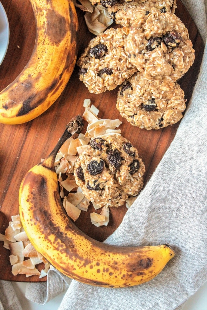 oatmeal cookies with banana and shredded coconut on a wooden serving board