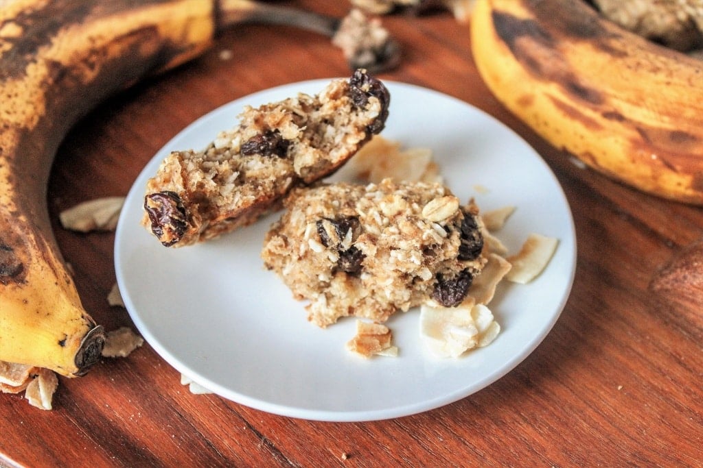 cookies on a plate with bananas in the background