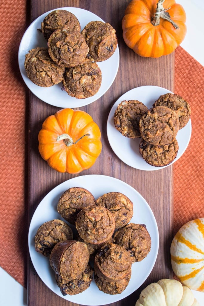 stacks of almond flour pumpkin muffins on small white plates