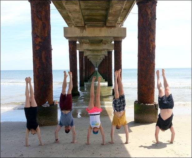 handstands on the beach