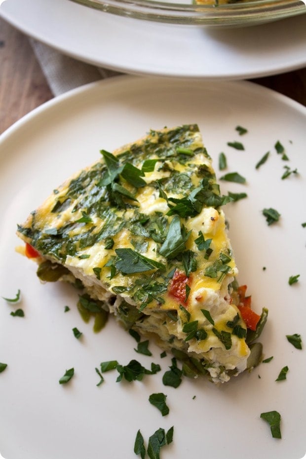 slice of veggie quiche with parsley on top