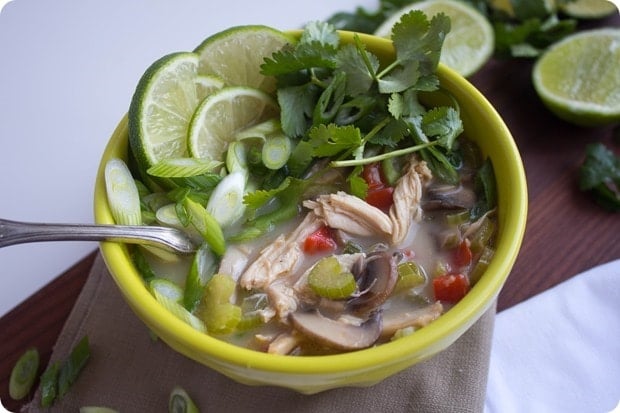 thai coconut chicken soup in a bowl with garnishes