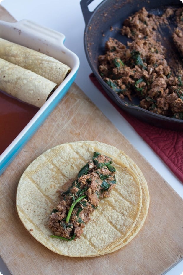 walnut enchiladas recipe process: rolling filling into tortilla