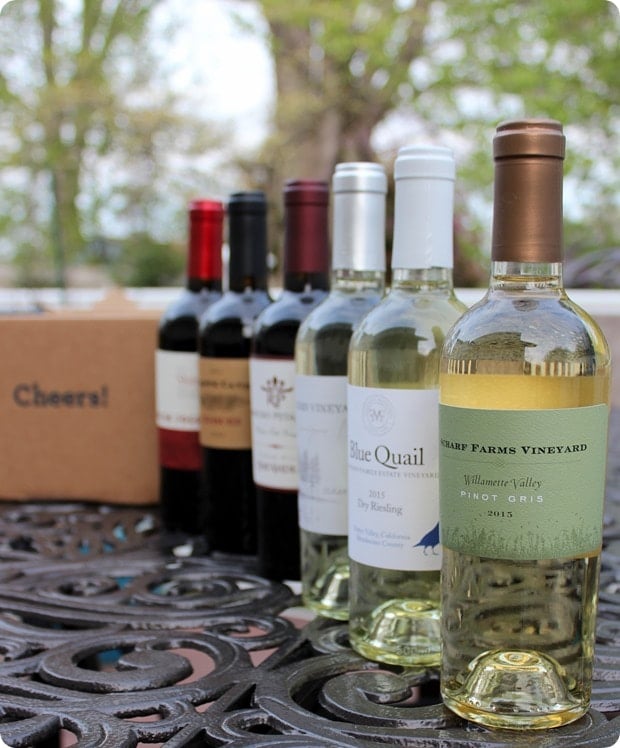 blue apron wine lined up on a table.