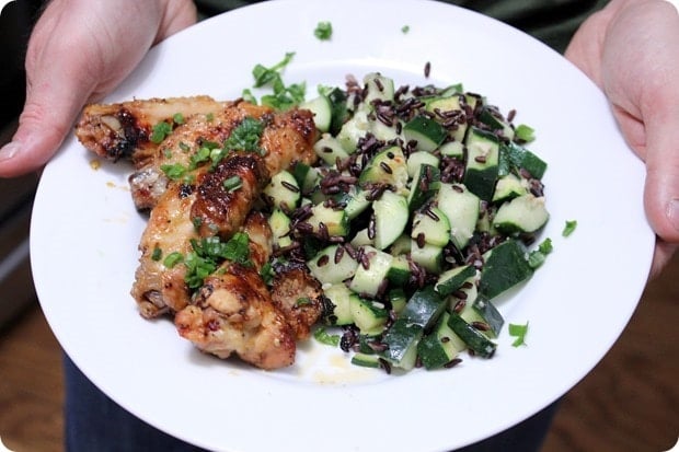 chicken wings with purple rice and zucchini