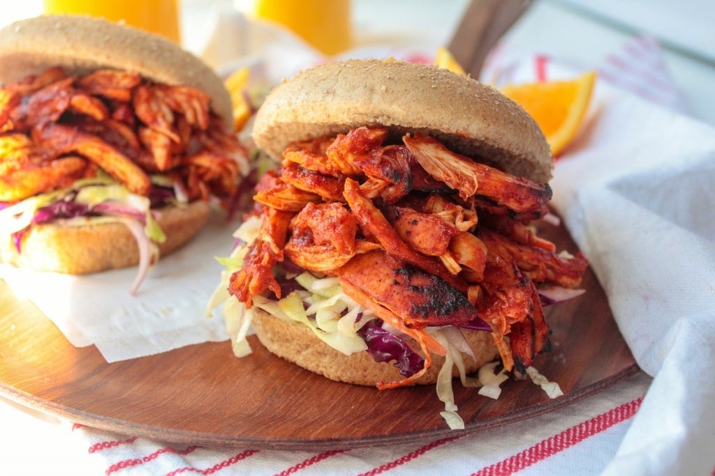 Orange Juice BBQ Chicken Sandwiches on a wooden platter