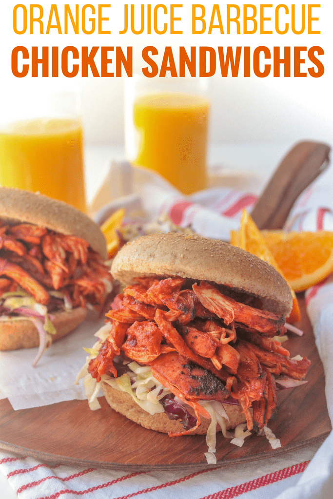 orange juice barbecue chicken sandwiches on a wooden platter: healthy grilling recipe for summer