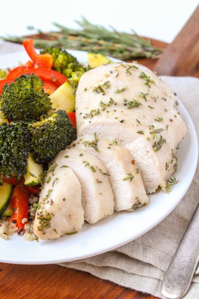 garlic herb chicken breast and roasted vegetables on a plate