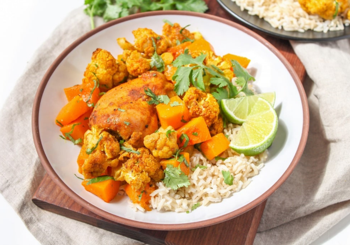 roasted chicken thighs with butternut squash and cauliflower over rice
