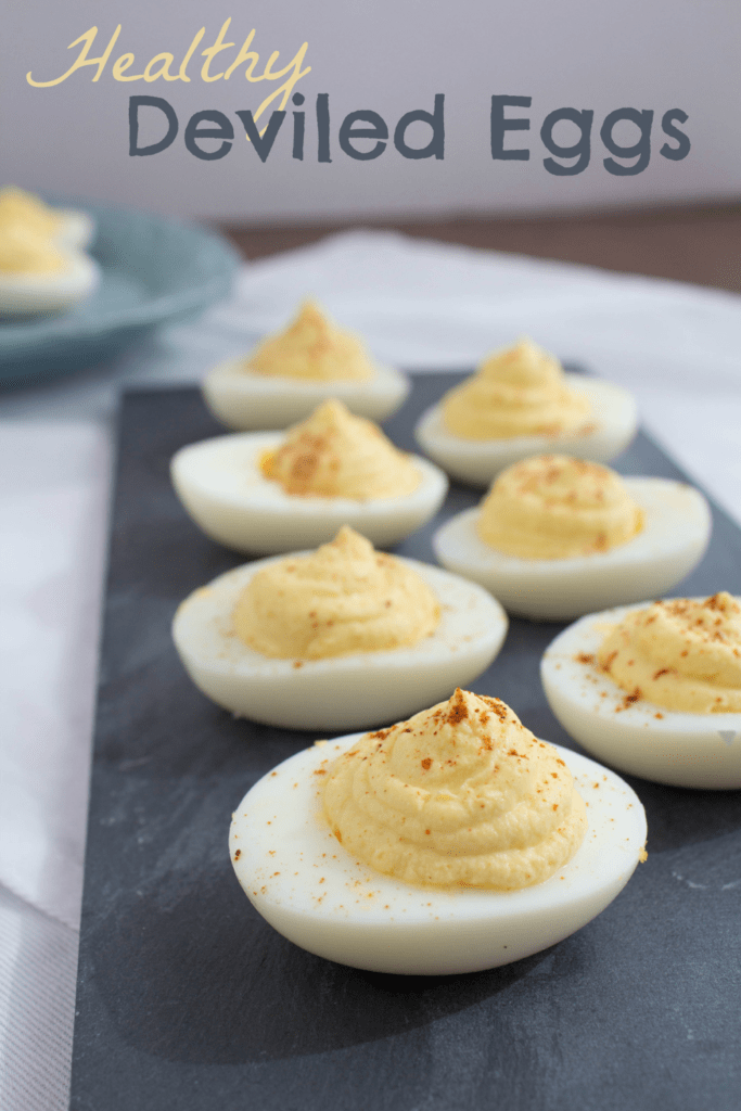 deviled eggs on a dark gray platter