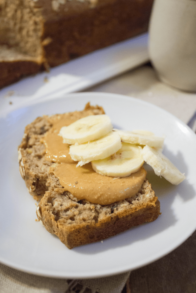 banana bread topped with peanut butter and banana slices