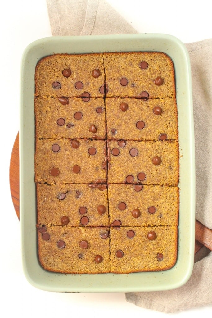 sliced dark chocolate healthy cookie bars in a baking dish