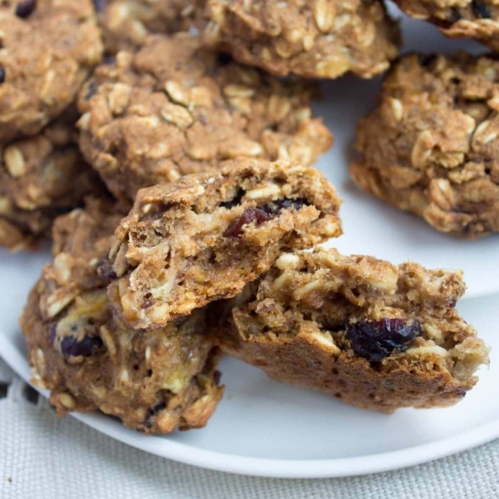 vegan pumpkin oatmeal cookies cut in half on a plate
