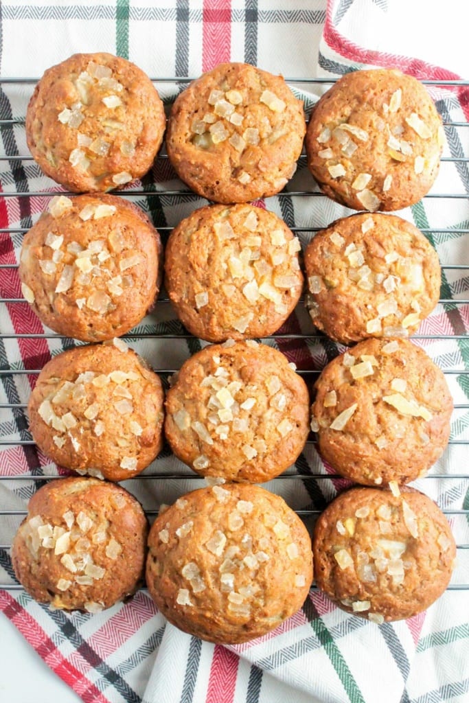 baked ginger pear muffins on a wire cooling rack