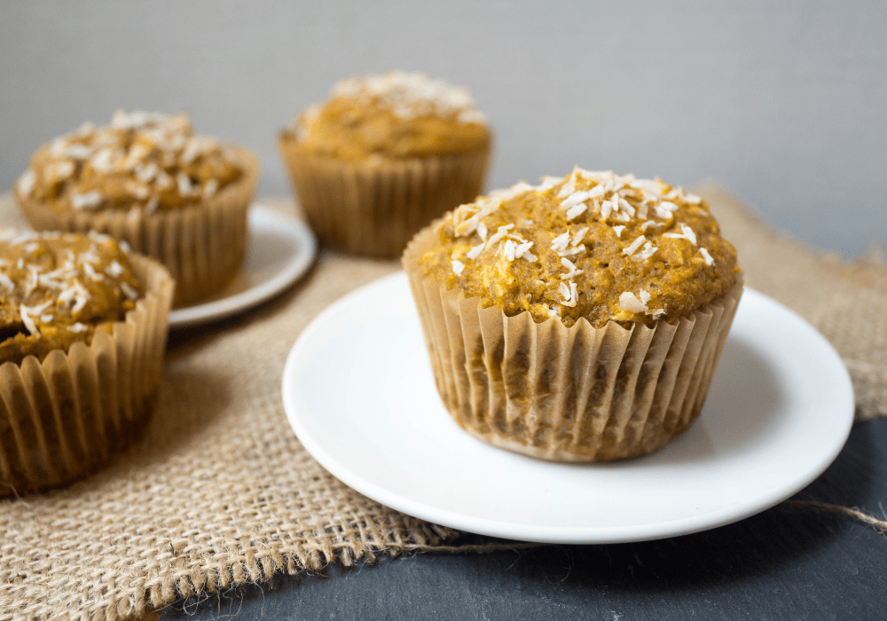 cranberry coconut sweet potato muffins on a plate