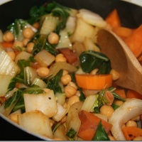 BBQ Chickpeas with Sweet Potatoes & Bok Choy in a skillet
