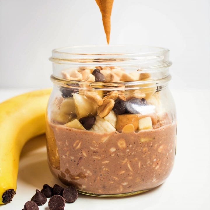 chocolate peanut butter banana overnight oats in a mason jar