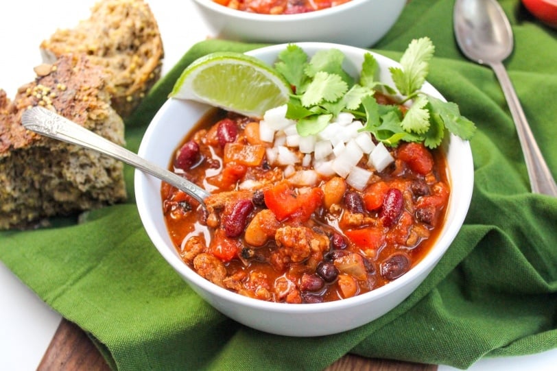 healthy slow cooker turkey chili with lime, onions, cilantro
