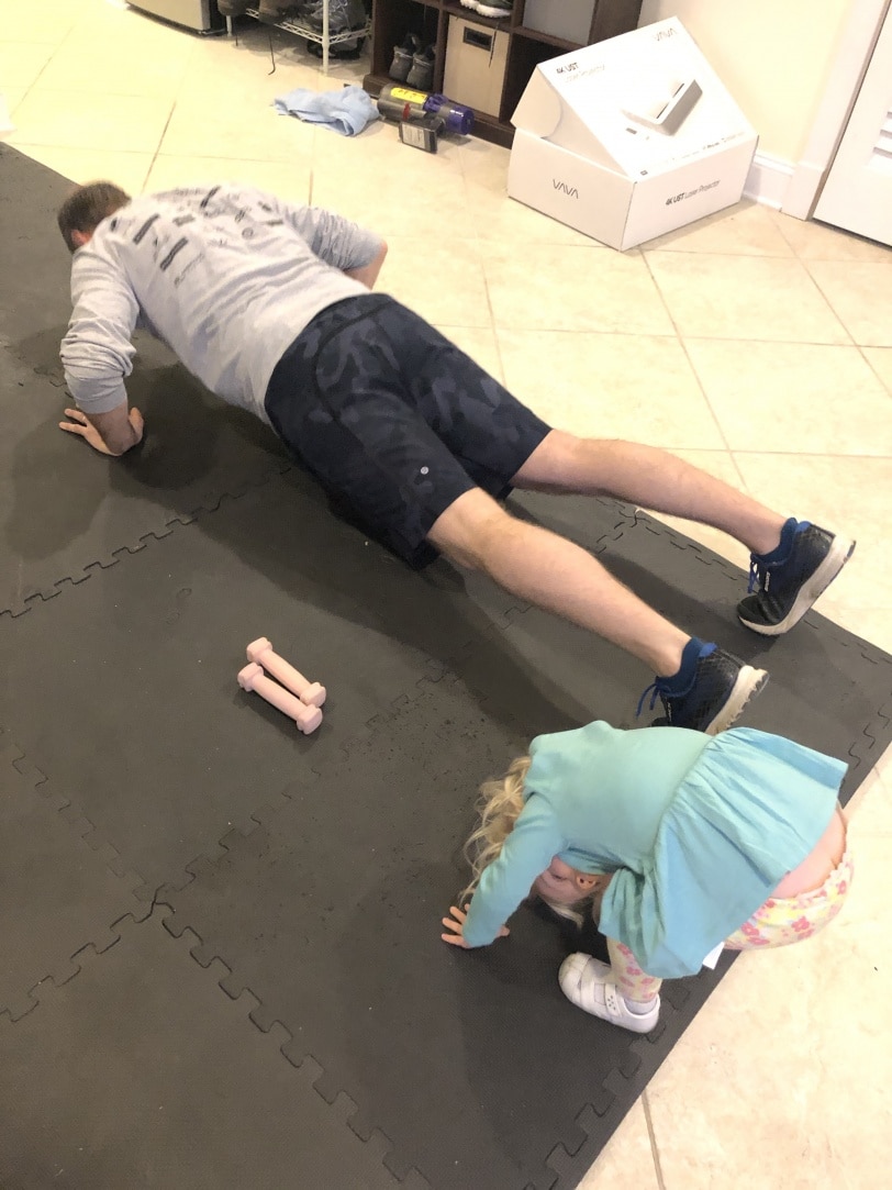 toddler exercising with dad