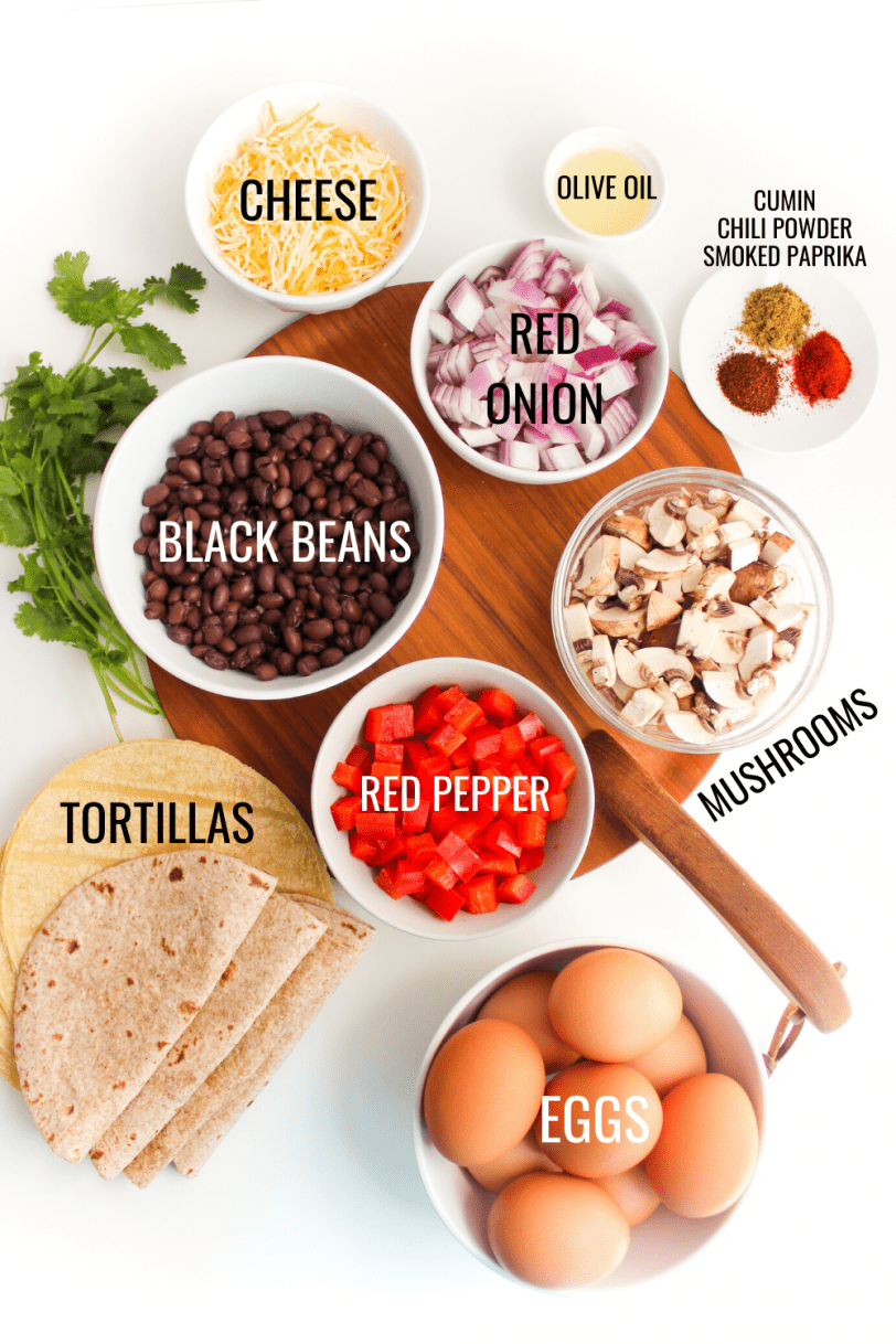 ingredients for healthy breakfast tacos recipe: eggs, black beans, mushrooms, bell peppers, etc.