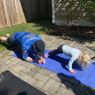 toddler exercising with dad