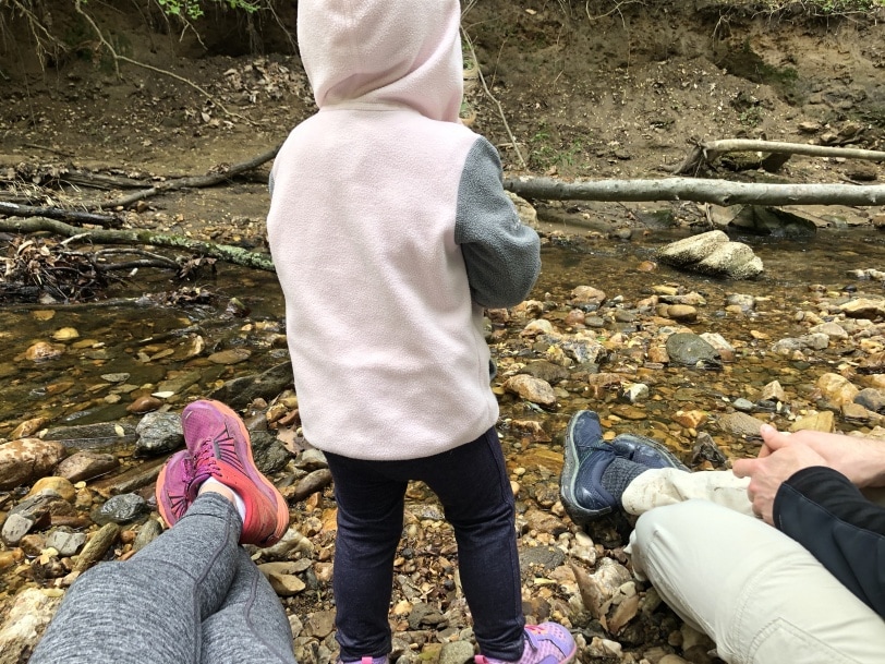 throwing rocks into a stream