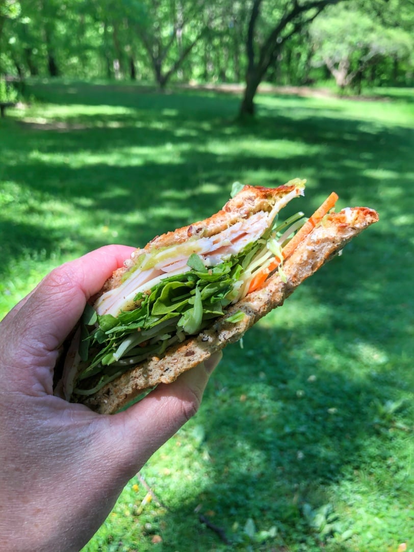 sandwich with turkey cheese guacamole and veggies