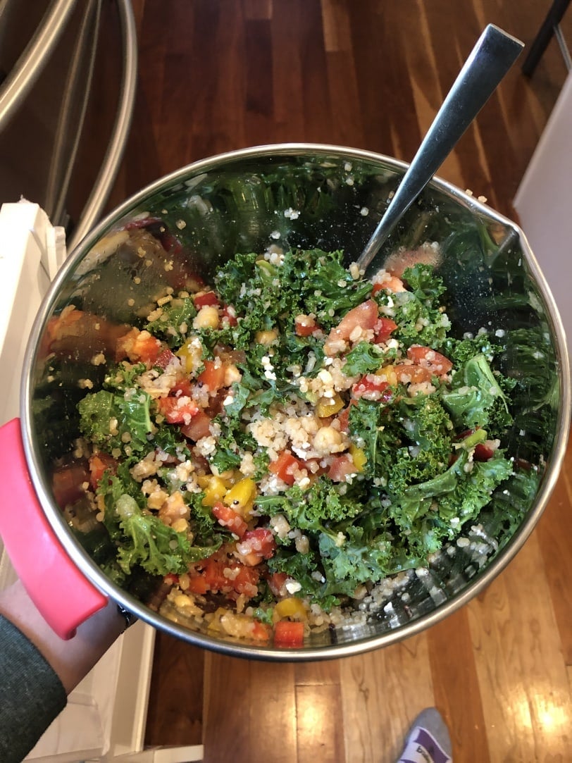 salad made with quinoa, kale, peppers, chickpeas, and vinaigrette