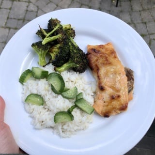 Asian salmon with pickled cucumber, roasted broccoli, and rice
