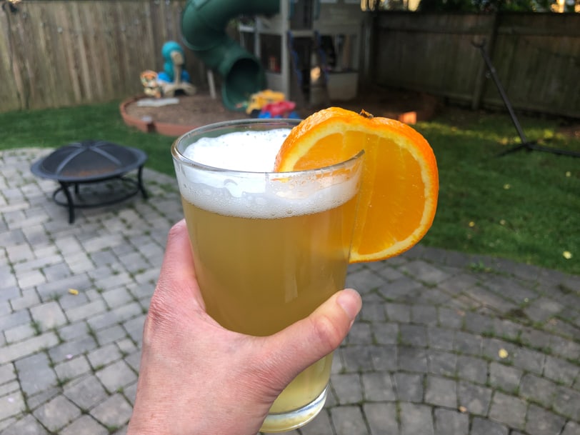 blue moon beer with an orange slice