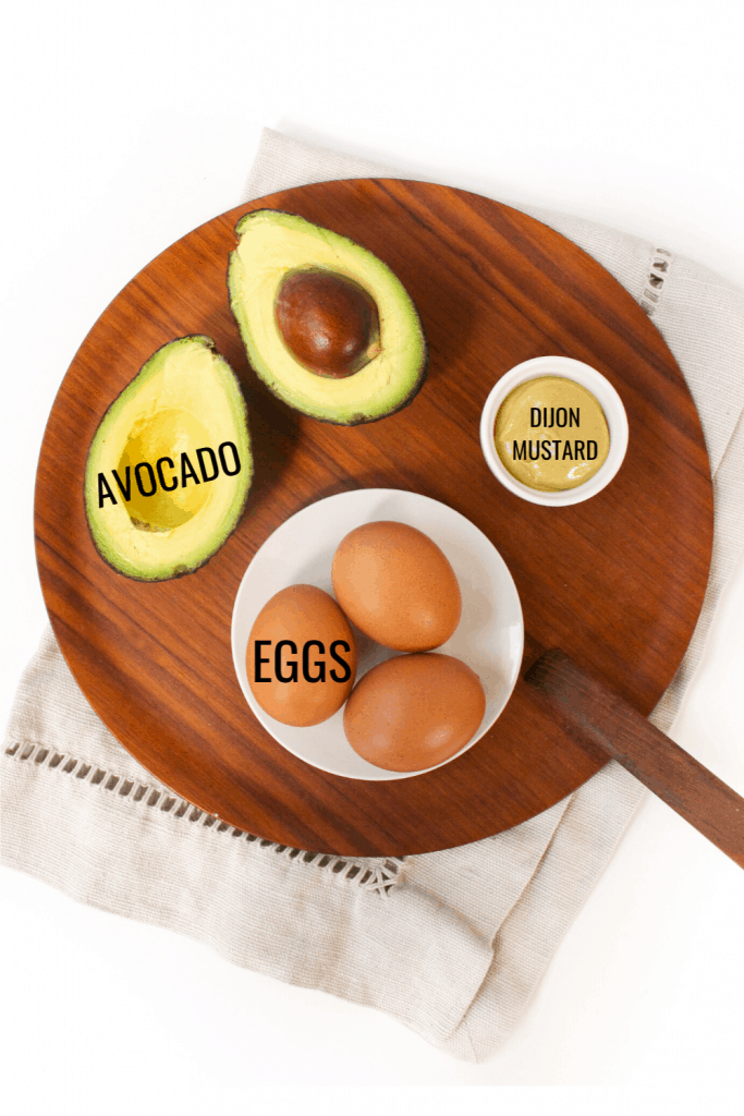 healthy egg salad ingredients: avocado, eggs, and dijon mustard