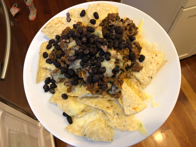 homemade nachos with black beans, beef, cheese