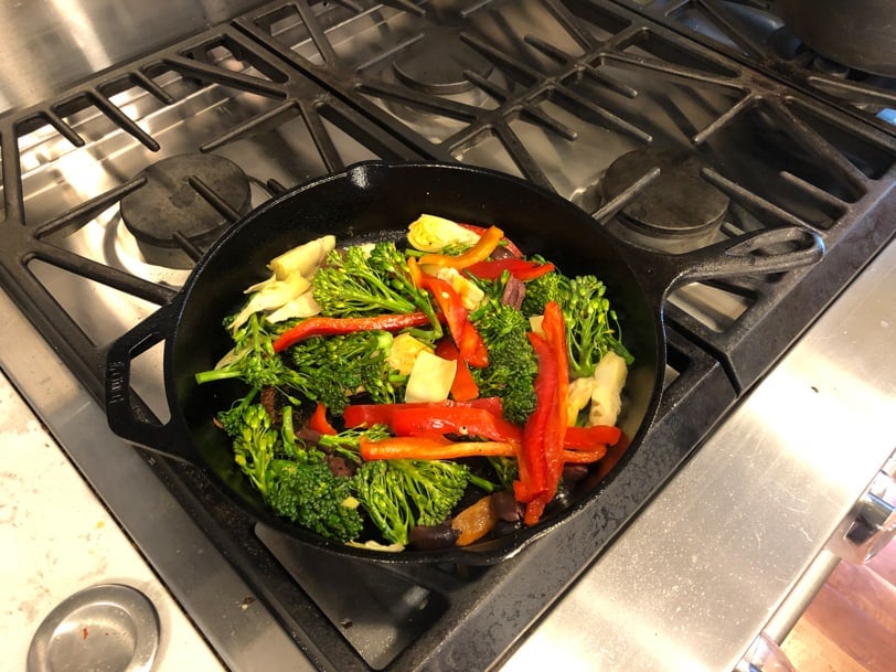 veggies cooking in a skillet