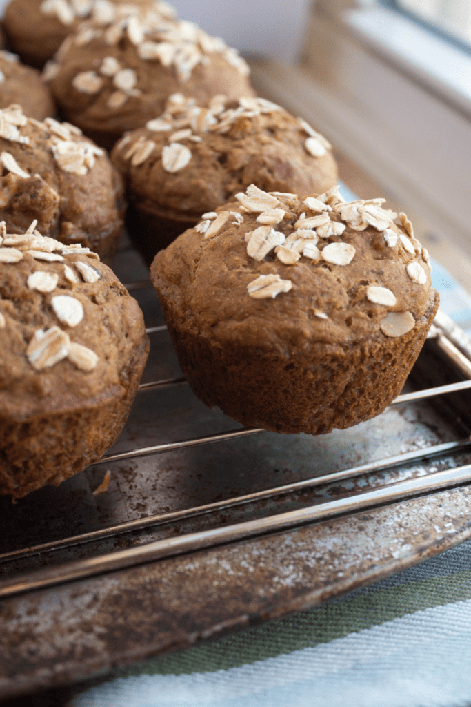 banana spelt muffins on a wire cooling rack