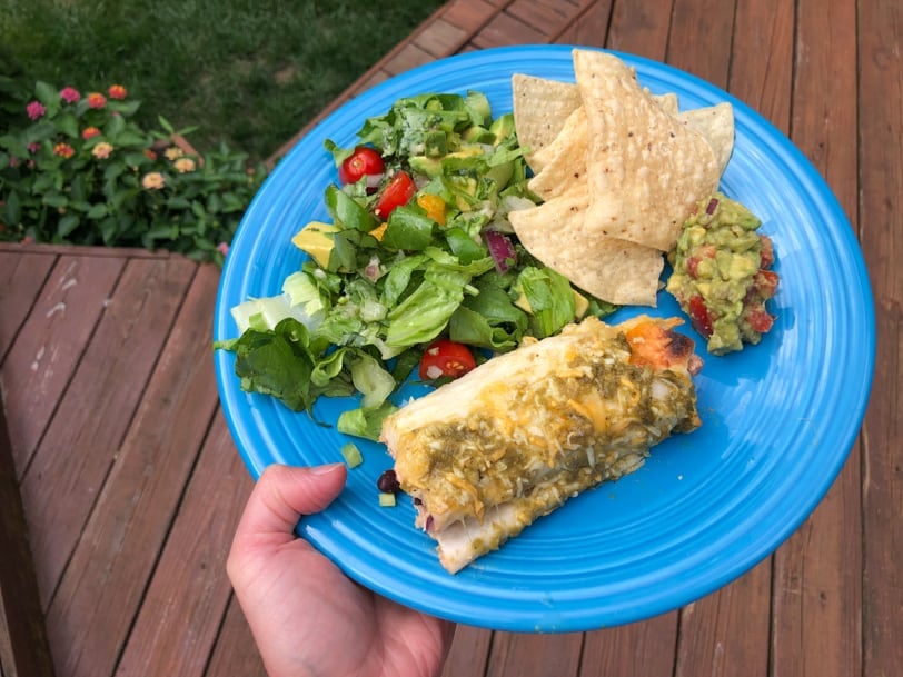 enchiladas with salad and chips and guacamole