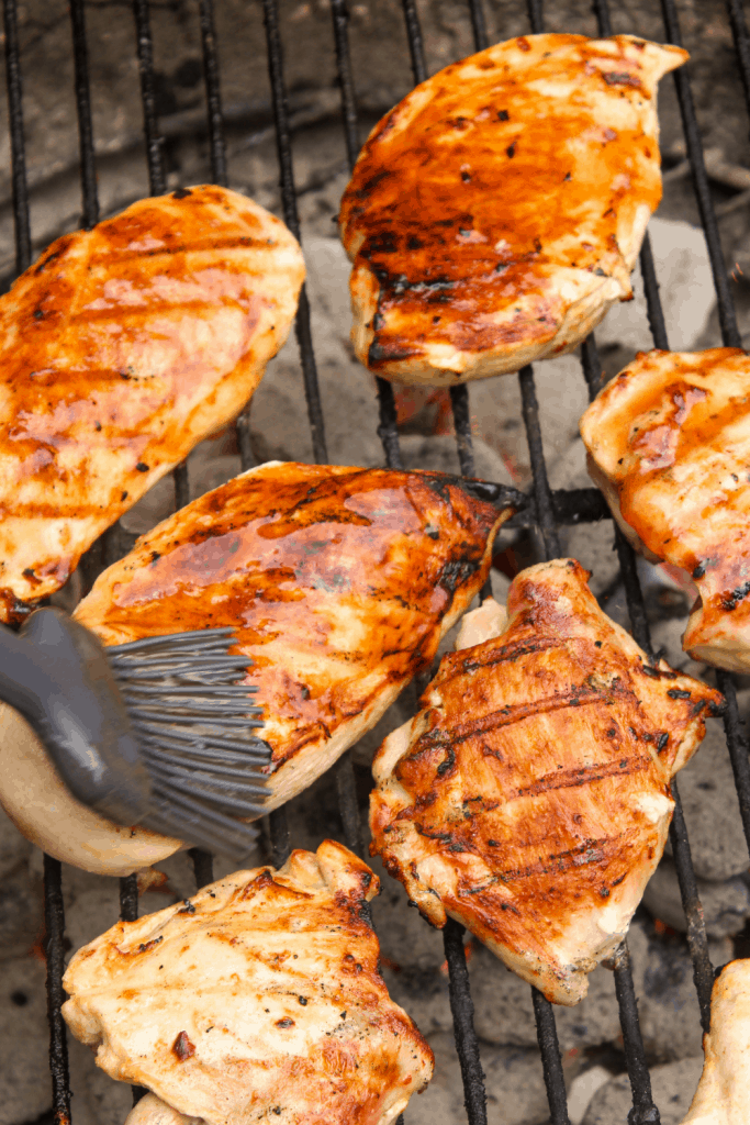 basting grilled chicken with balsamic glaze