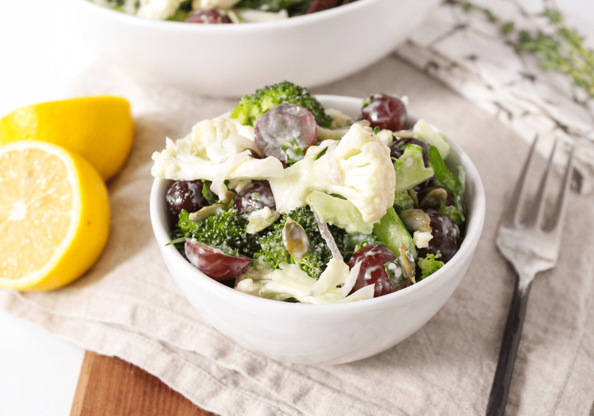 broccoli cauliflower salad in a white bowl