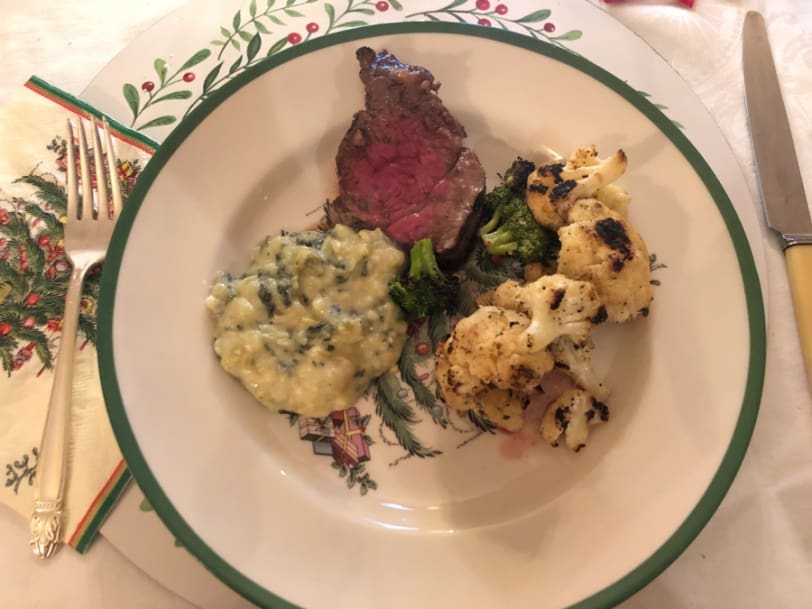 steak with mashed potatoes and roasted cauliflower and broccoli
