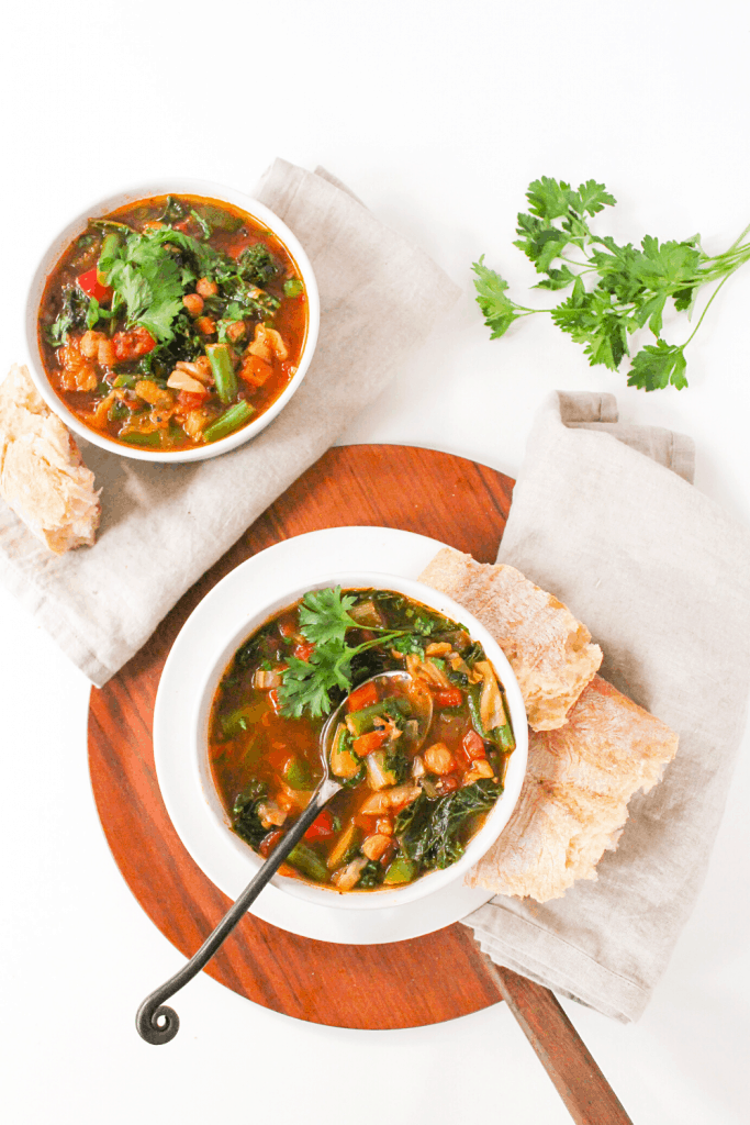 Instant Pot veggie soup in a white bowl