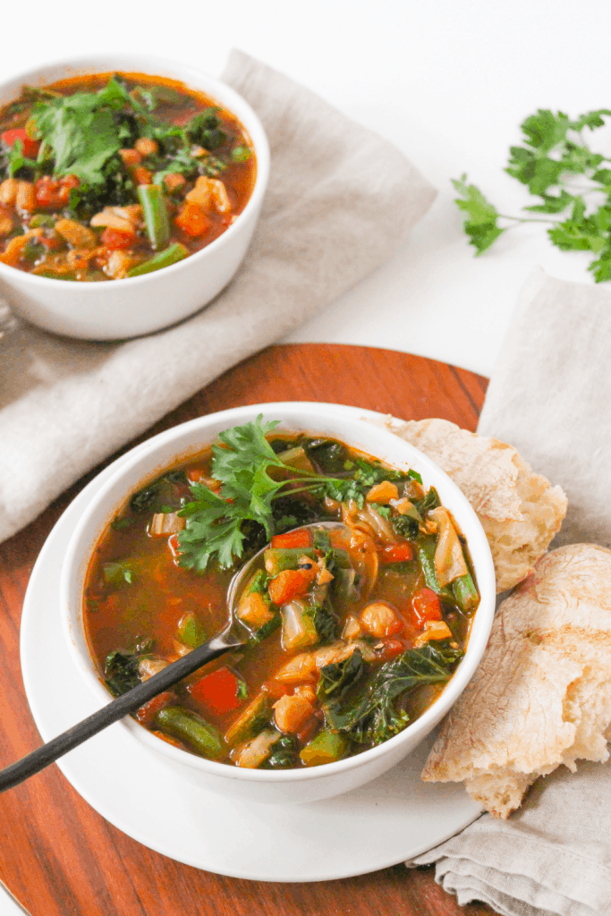 Instant Pot veggie soup on a wooden platter