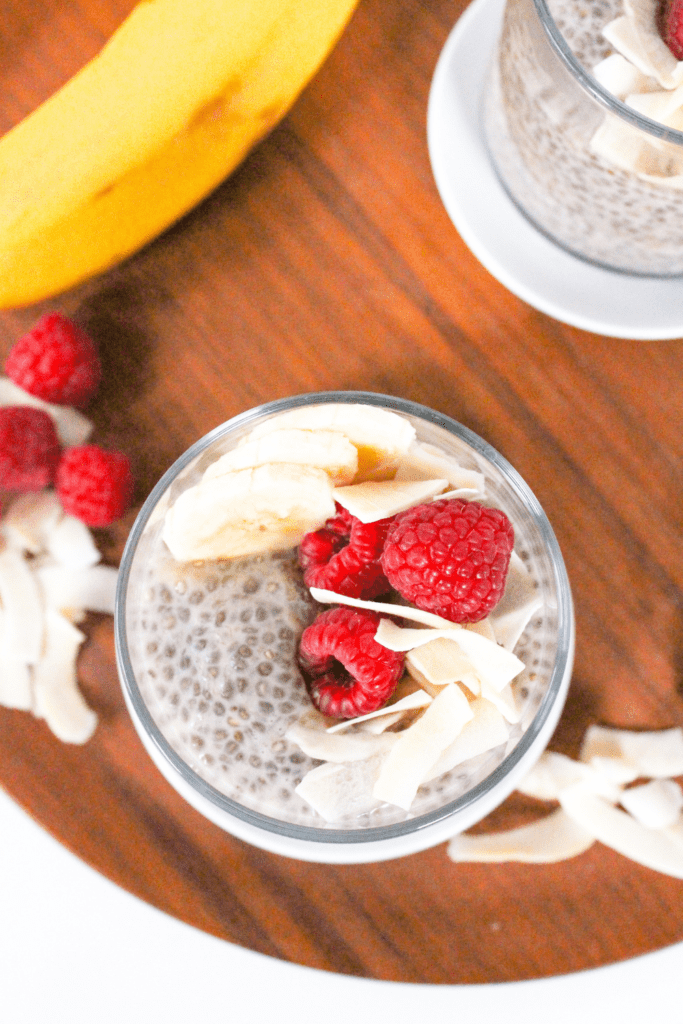 banana chia pudding with coconut milk and raspberries