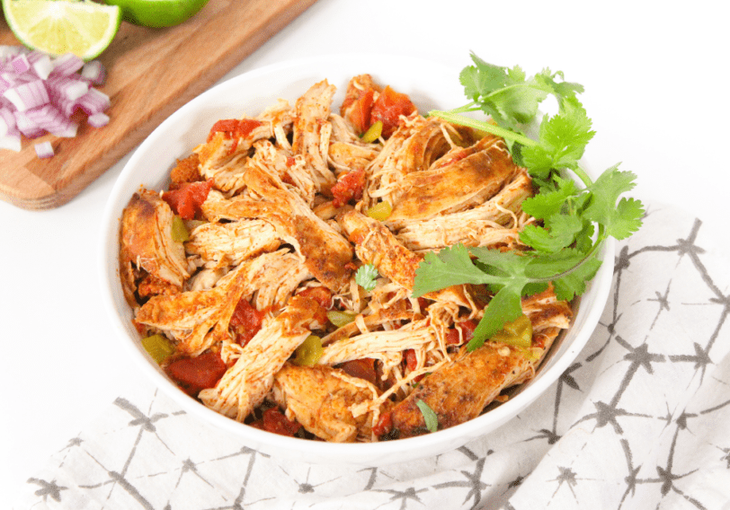 crockpot mexican shredded chicken in a white bowl
