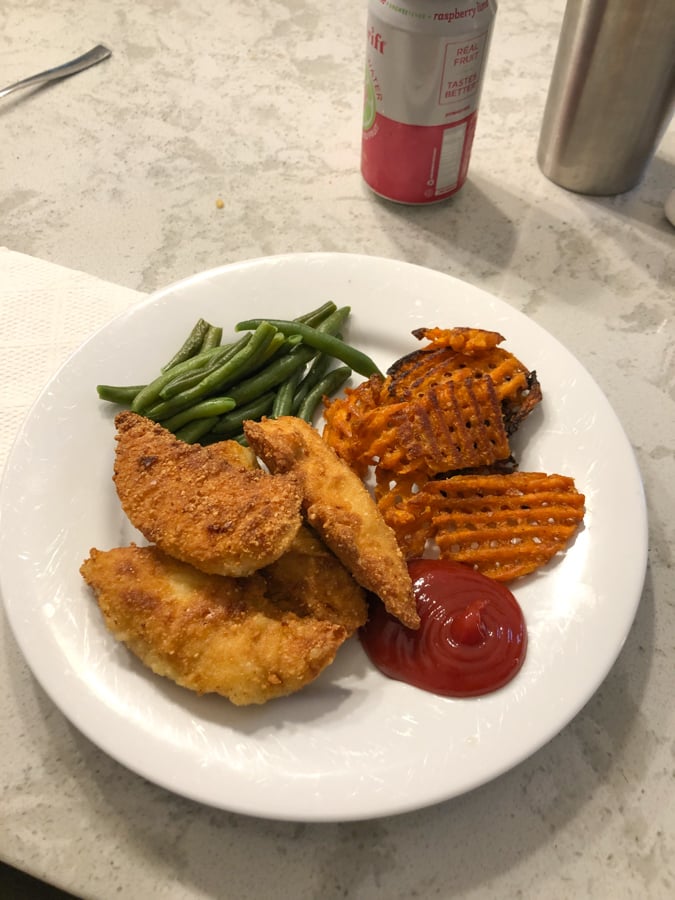 chicken fingers and sweet potato fries with string beans