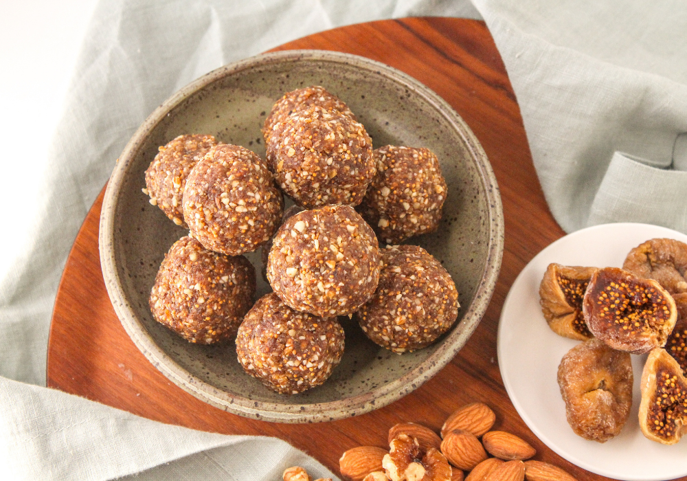 vanilla bliss balls with figs and nuts on a plate