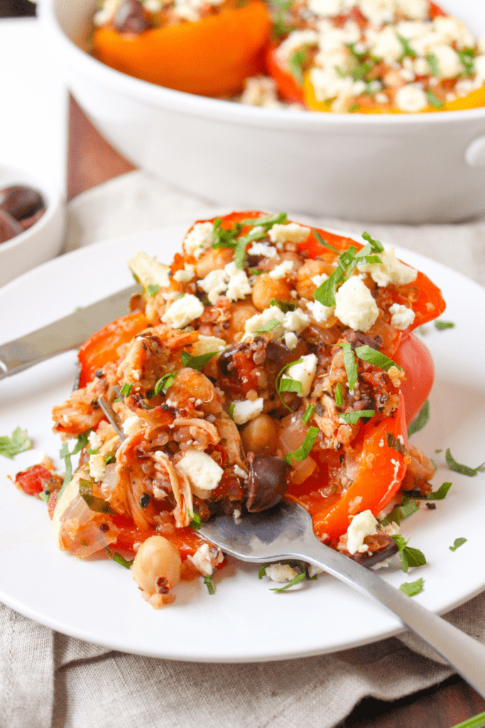 quinoa and chicken stuffed peppers on a plate