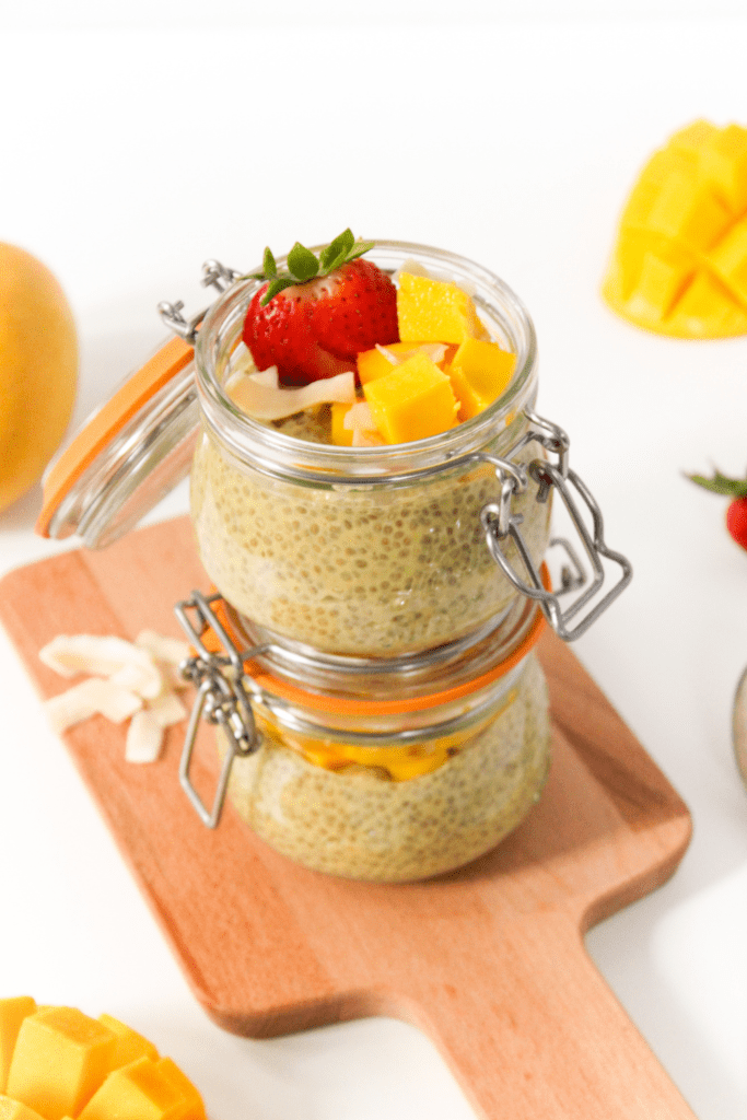 mango chia pudding in jars stacked on top of each other