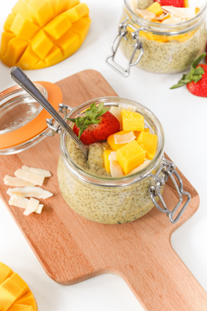 coconut milk chia pudding with sliced mango and strawberries
