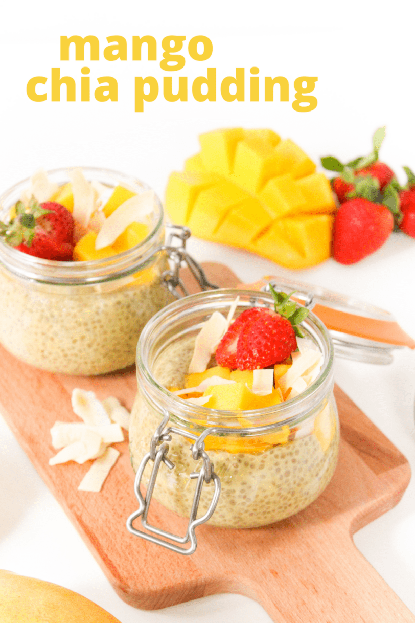 mango chia pudding with coconut and strawberries in a jar